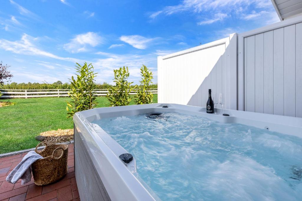 a hot tub in the backyard of a house at Wellness- Doppelhaushälfte "Meer" in Fehmarn