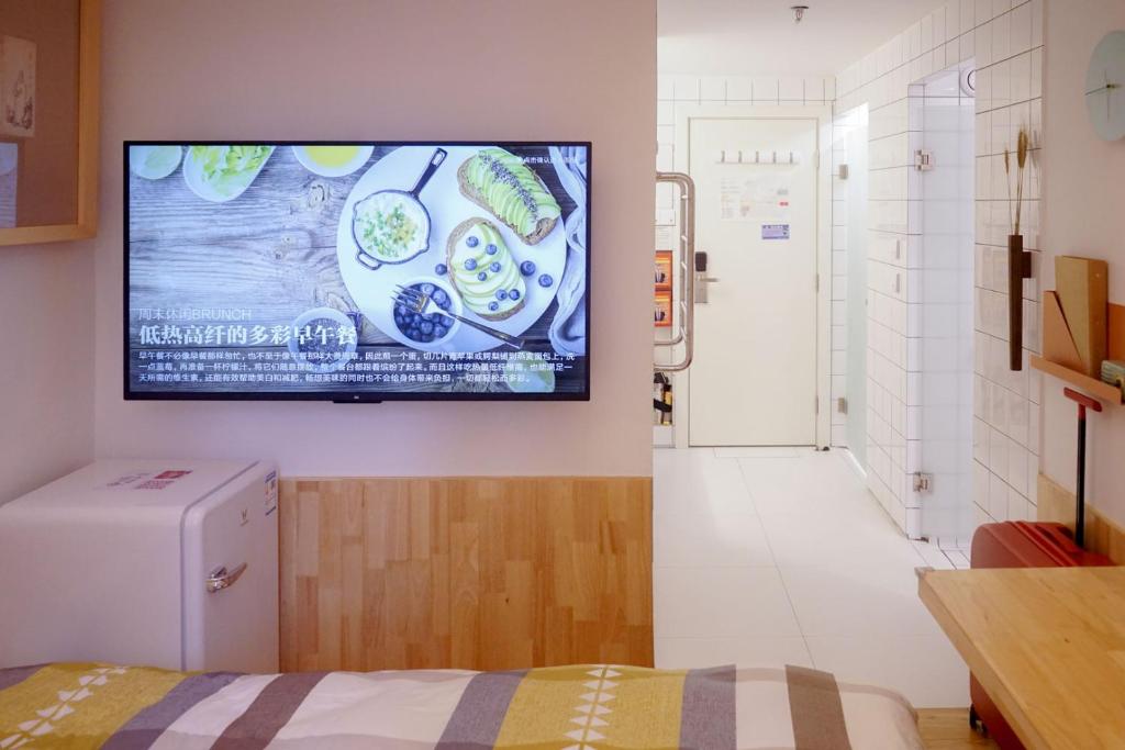 TV a/nebo společenská místnost v ubytování TGS Studio Hotel