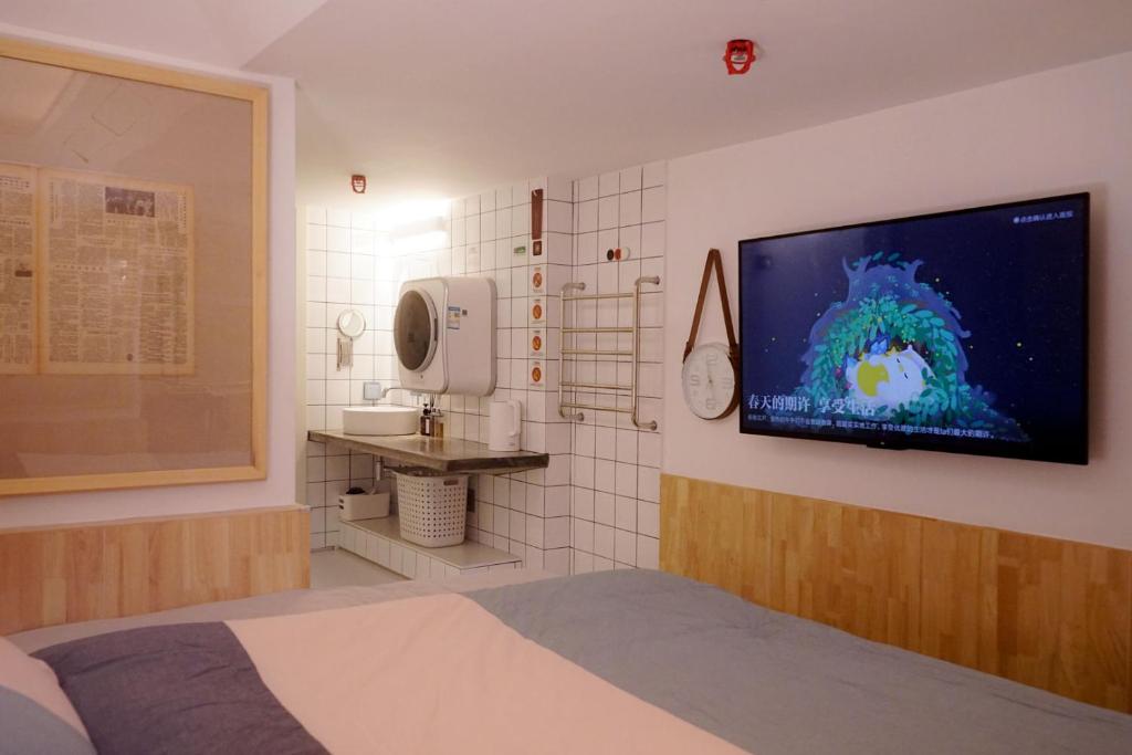TV a/nebo společenská místnost v ubytování TGS Studio Hotel