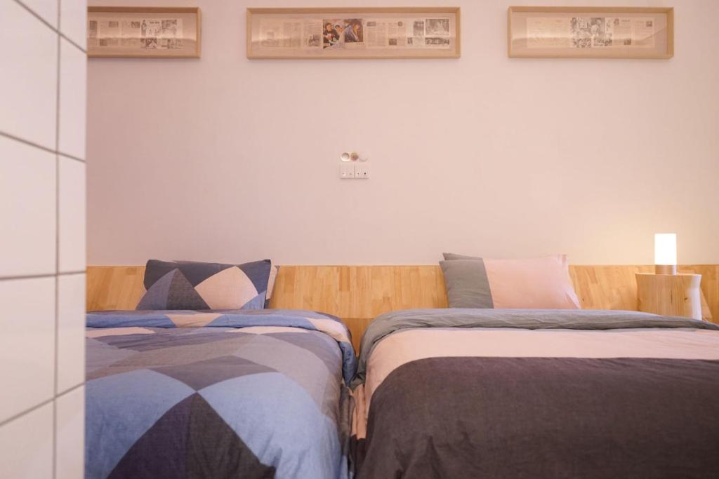 Postel nebo postele na pokoji v ubytování TGS Studio Hotel