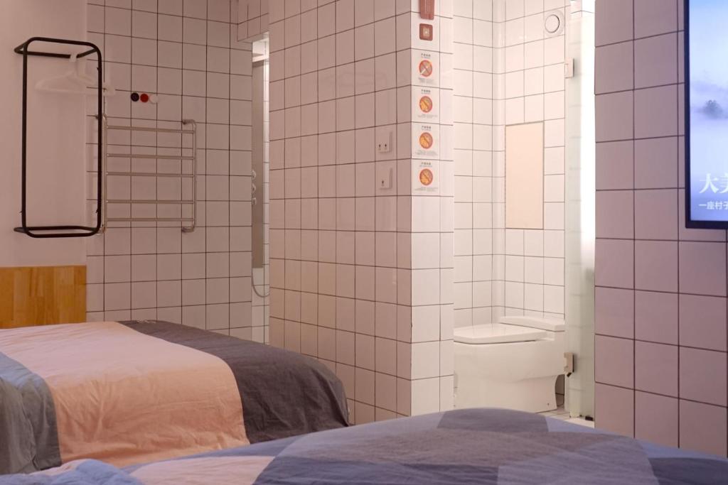 Postel nebo postele na pokoji v ubytování TGS Studio Hotel