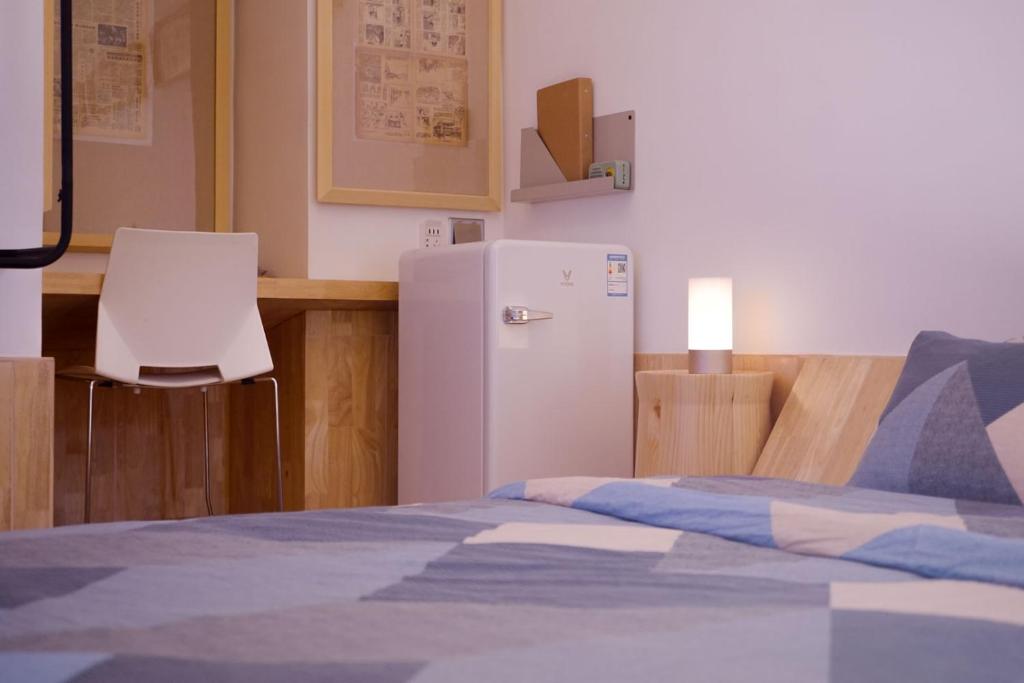 Postel nebo postele na pokoji v ubytování TGS Studio Hotel