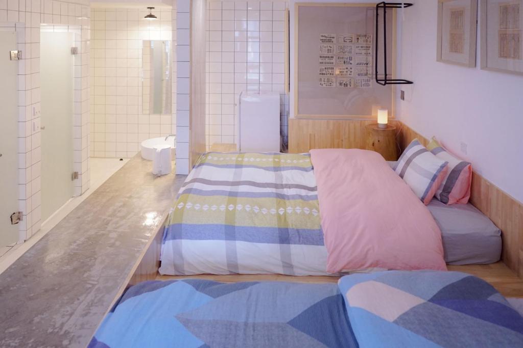 Postel nebo postele na pokoji v ubytování TGS Studio Hotel
