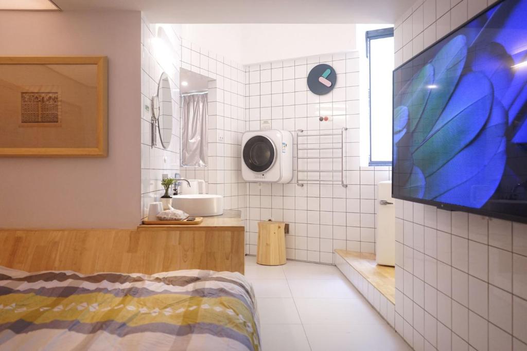 TV a/nebo společenská místnost v ubytování TGS Studio Hotel