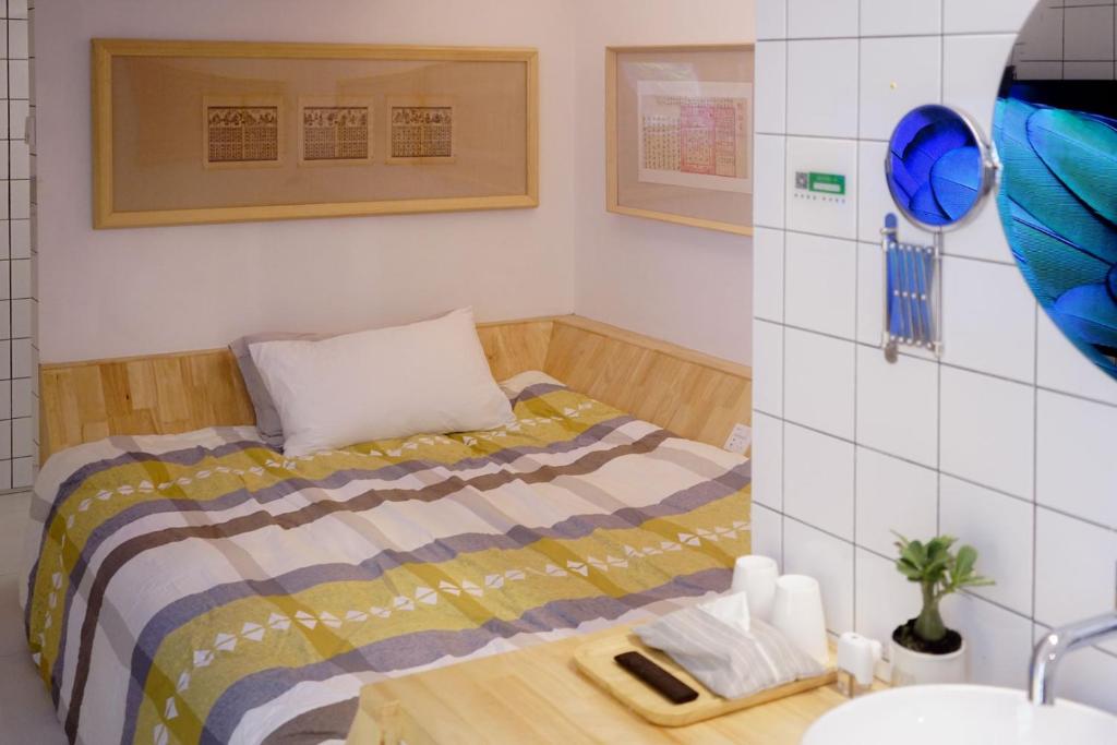 Postel nebo postele na pokoji v ubytování TGS Studio Hotel