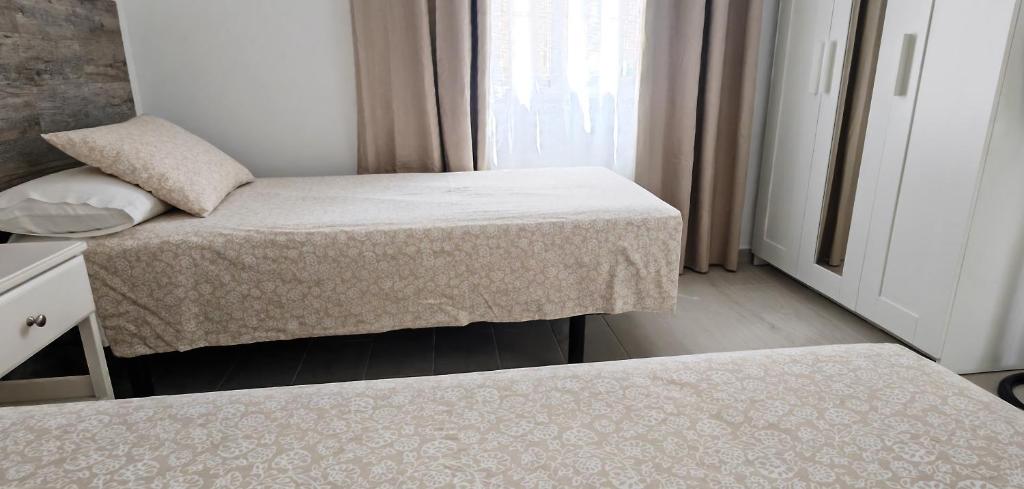 A bed or beds in a room at Villa Magnolia