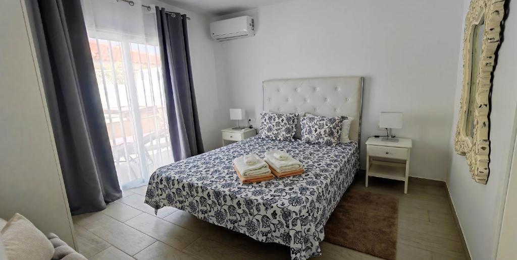 A bed or beds in a room at Villa Magnolia