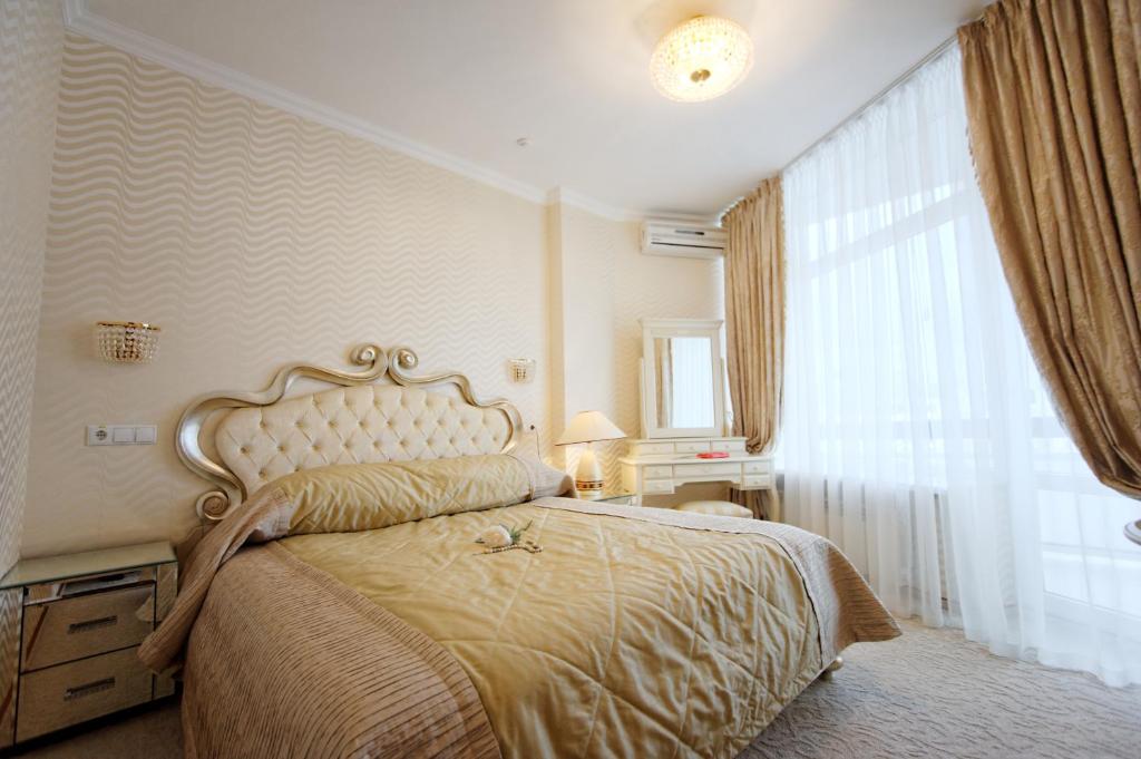Postel nebo postele na pokoji v ubytování Hotel Kyiv