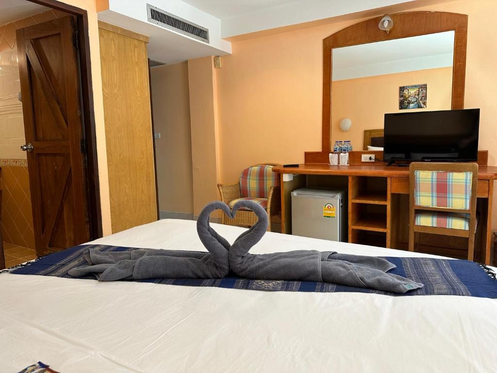 Postel nebo postele na pokoji v ubytování Nid Huahin Hotel