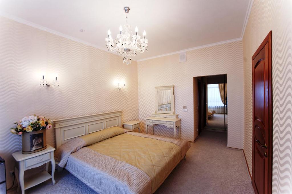 Postel nebo postele na pokoji v ubytování Hotel Kyiv