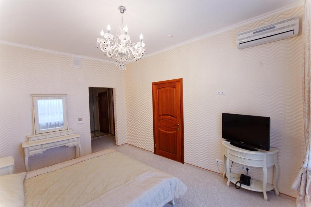 Postel nebo postele na pokoji v ubytování Hotel Kyiv