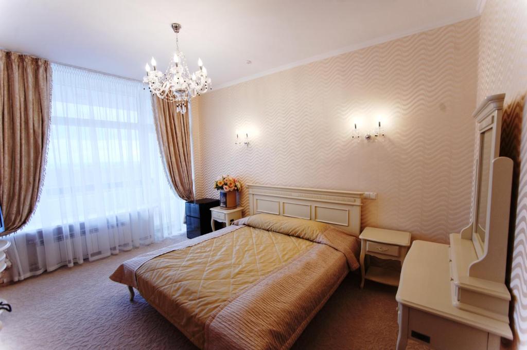Postel nebo postele na pokoji v ubytování Hotel Kyiv
