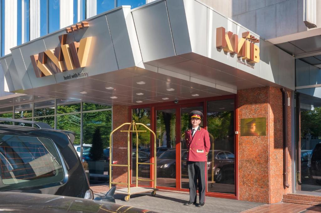 a man standing in front of a building at Hotel Kyiv in Kyiv
