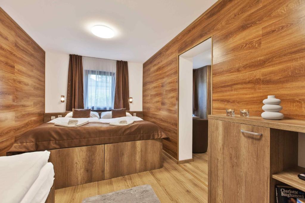 Postel nebo postele na pokoji v ubytování Apartmány Termál