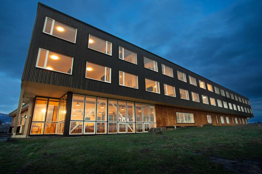a large building with many windows at night at Best Western Patagonia in Puerto Natales