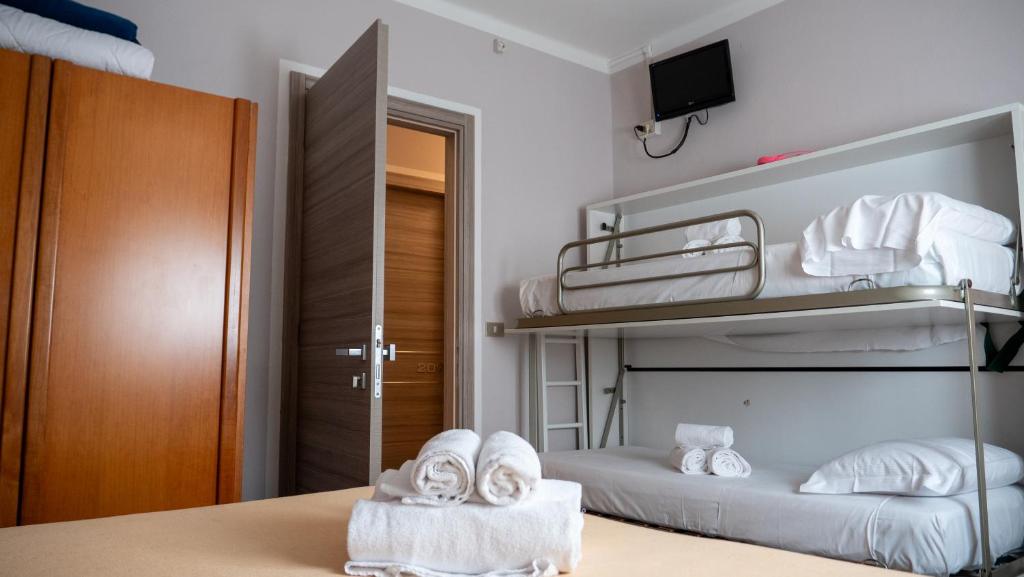Postel nebo postele na pokoji v ubytování Albergo Tecla