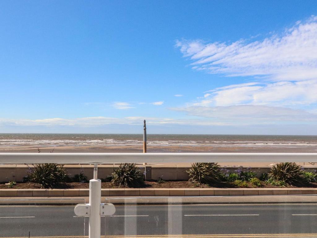 a view of the beach and a road at 26 North Promenade in Cleveleys