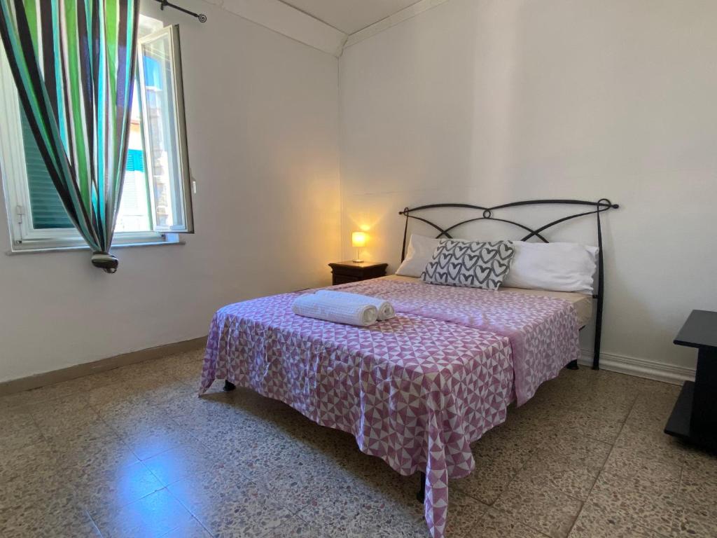 Postelja oz. postelje v sobi nastanitve Apartment in Palazzo Mazzini