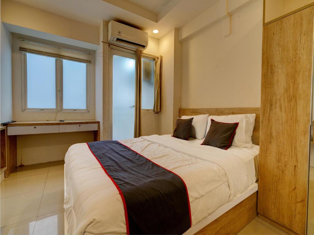 Lova arba lovos apgyvendinimo įstaigoje Collection O 92870 Apartement Grand Sentraland Karawang By Ipul