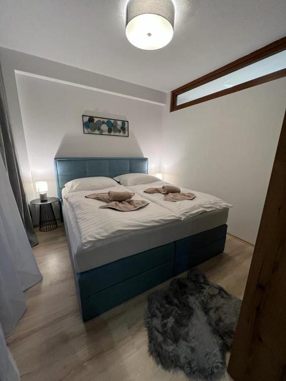 A bed or beds in a room at LUX apartmany Romantika CHOPOK 7, 19