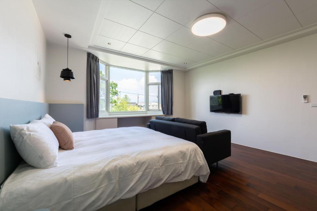 Postel nebo postele na pokoji v ubytování Slow Pine Homestay