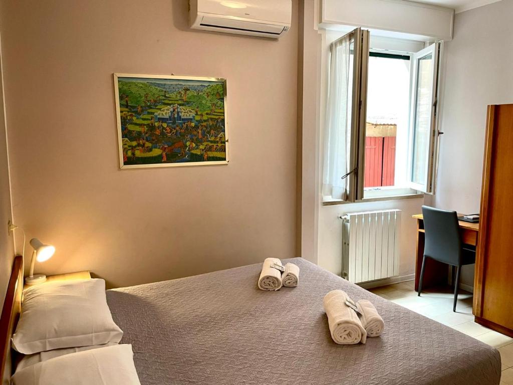 Postel nebo postele na pokoji v ubytování Albergo Tecla