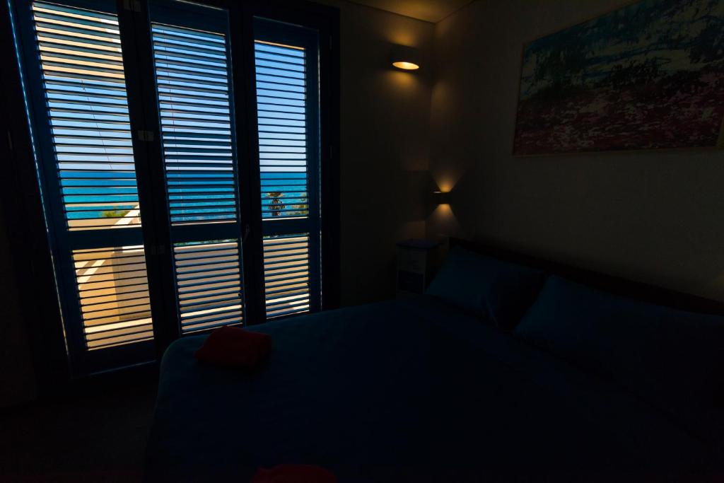 Postel nebo postele na pokoji v ubytování Solmaris Seaside - B&B sul mare