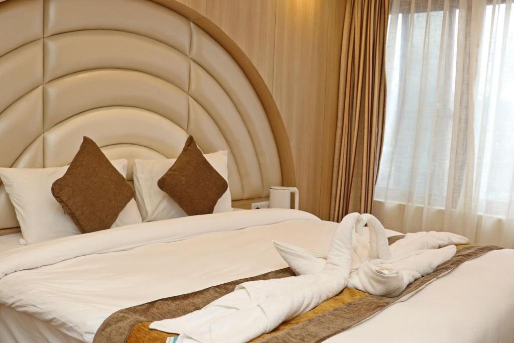 Postel nebo postele na pokoji v ubytování Hotel Airport Gurkha