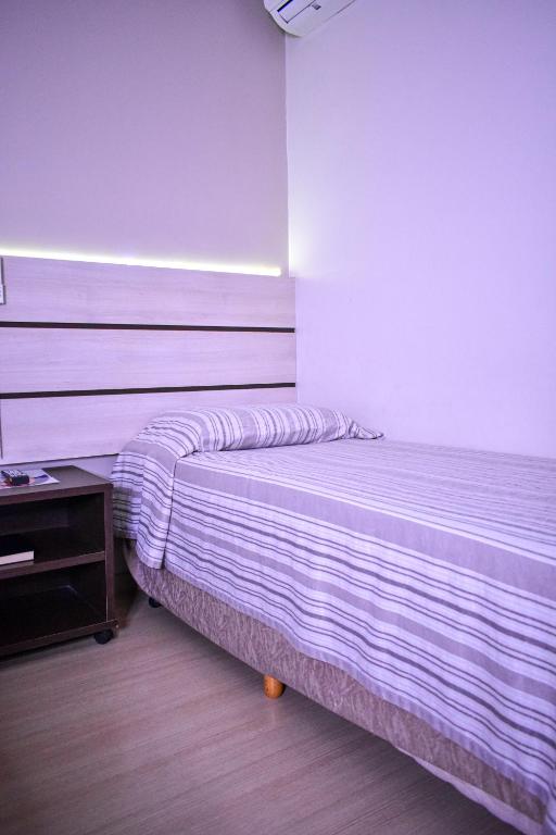 Postel nebo postele na pokoji v ubytování Barigui Park Hotel