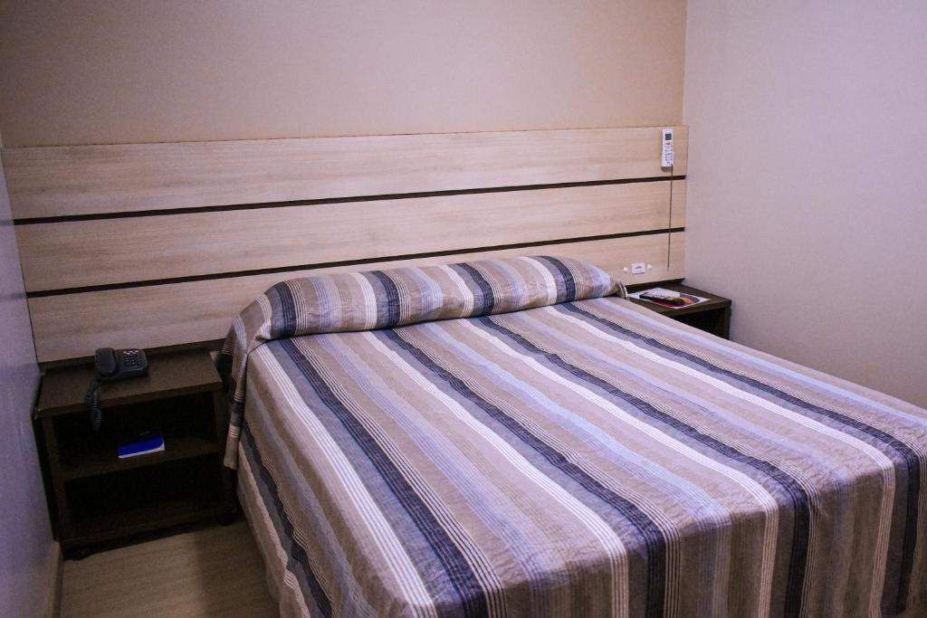 Postel nebo postele na pokoji v ubytování Barigui Park Hotel