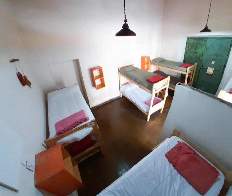 Postel nebo postele na pokoji v ubytování Cielito Lindo