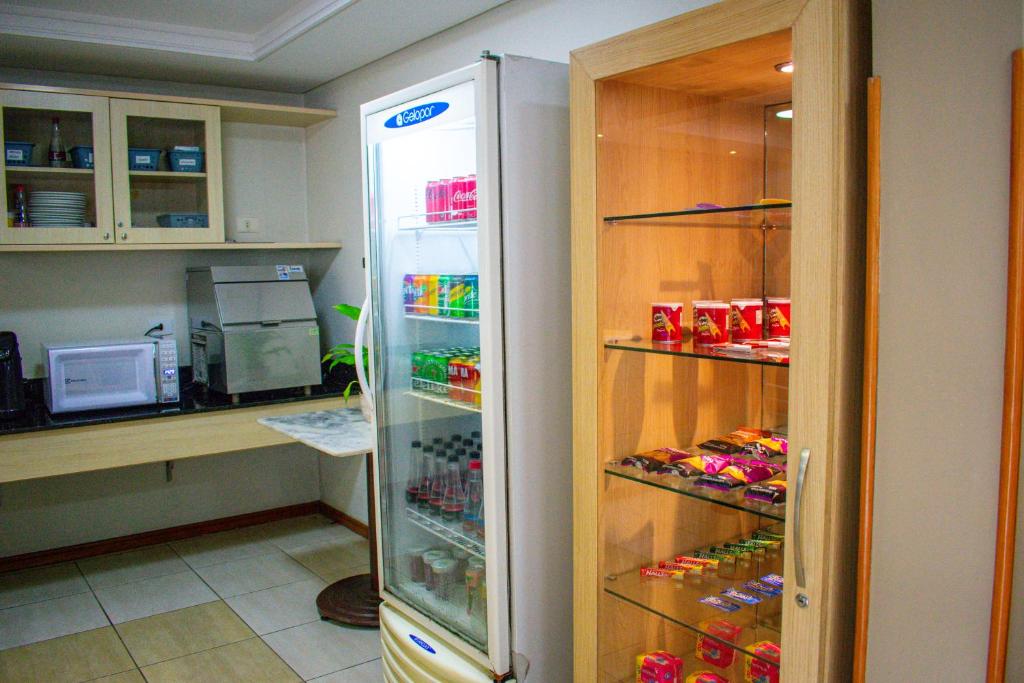 Kuchyň nebo kuchyňský kout v ubytování Barigui Park Hotel
