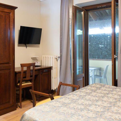 Televízia a/alebo spoločenská miestnosť v ubytovaní Casa Nicolini
