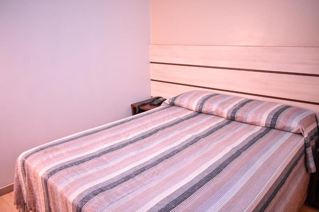 Postel nebo postele na pokoji v ubytování Barigui Park Hotel
