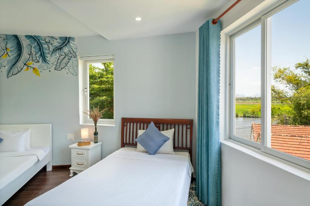 Giường trong phòng chung tại La Casa Tra Que