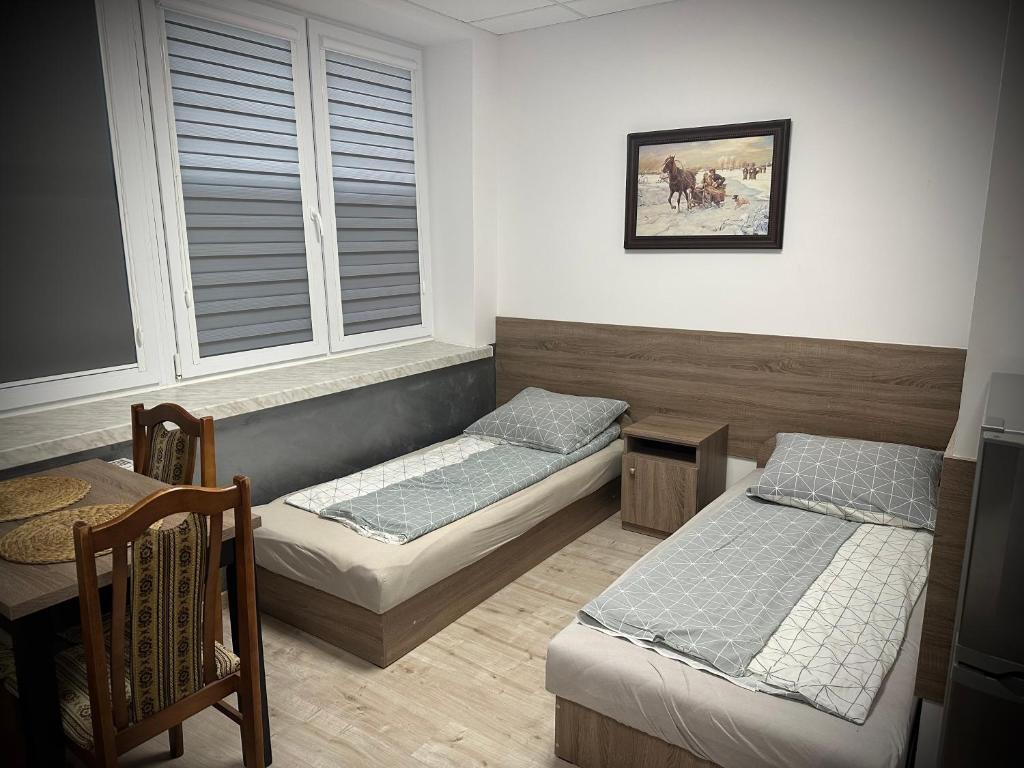 Łóżko lub łóżka w pokoju w obiekcie Hostel Sportowa