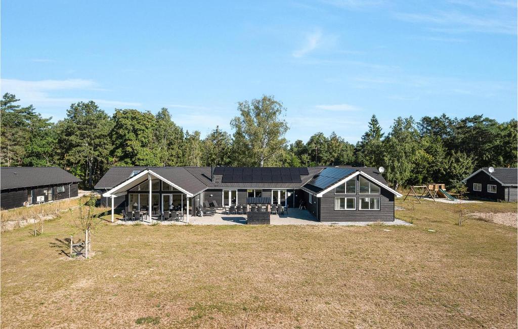 a house is being built in a field at Beautiful Home In Frederiksvrk With Kitchen in Asserbo