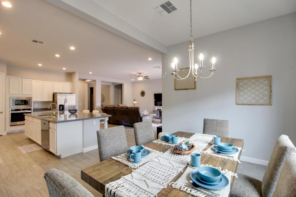 a kitchen and living room with a table and chairs at Pet-Friendly Marana Home Community Pool and Hot Tub in Marana