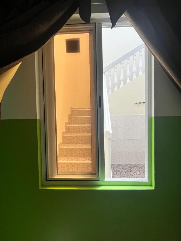 a view of a staircase through a window at Casa BB&Djassi in Ponta do Sol