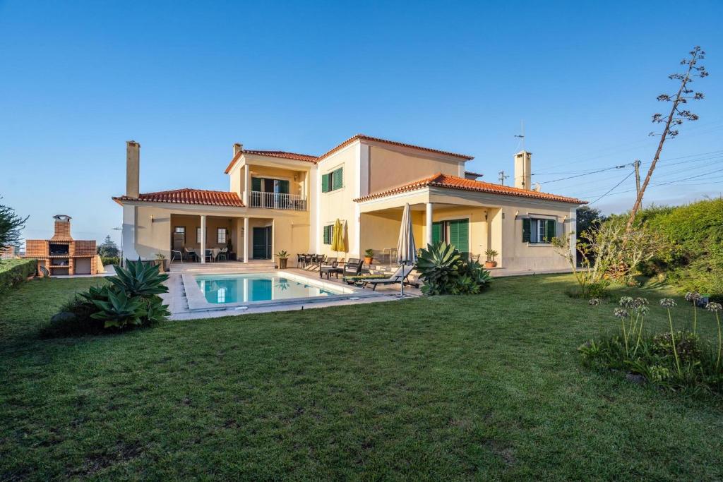 a house with a swimming pool in a yard at Akivillas Sintra Delicacy in Sintra
