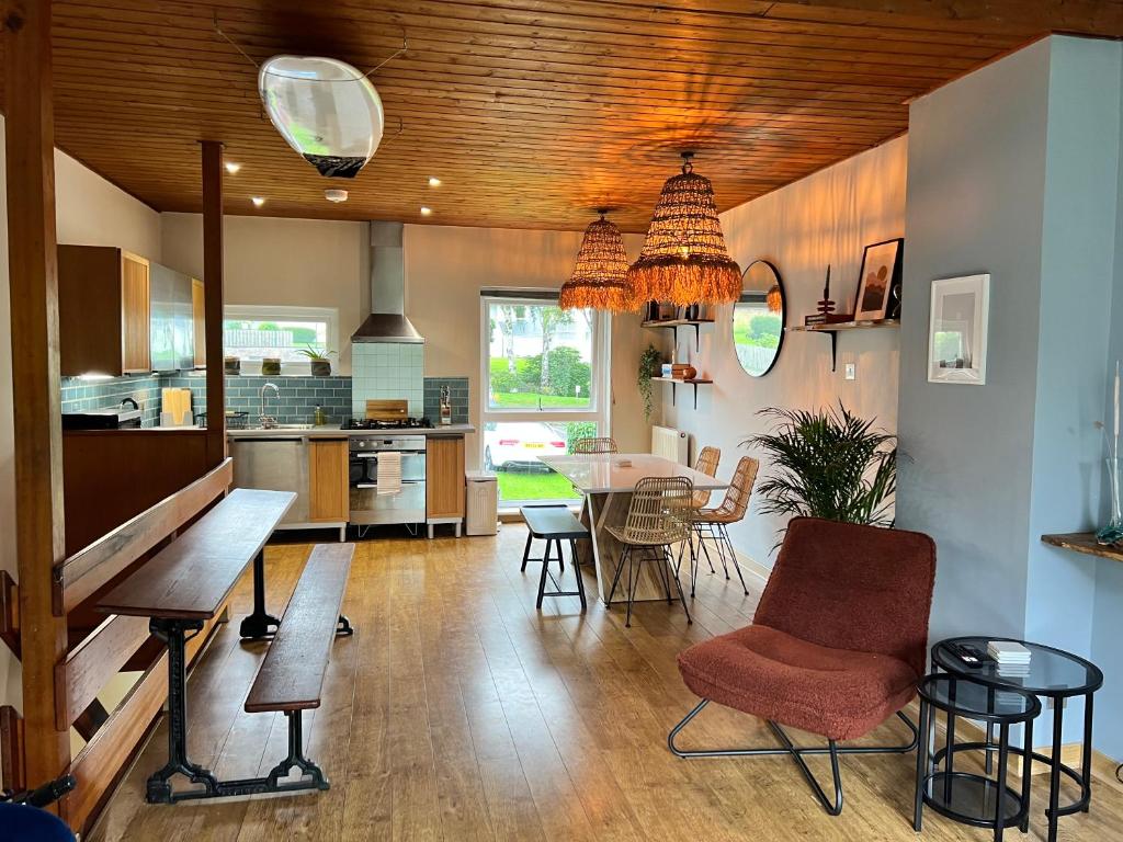 a kitchen and dining room with a table and chairs at Stylish Getaway in Y Felinheli Marina in Y Felinheli
