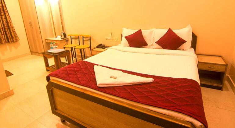 Postel nebo postele na pokoji v ubytování JJs PARK INN