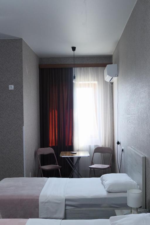 Postel nebo postele na pokoji v ubytování Hotel West Face
