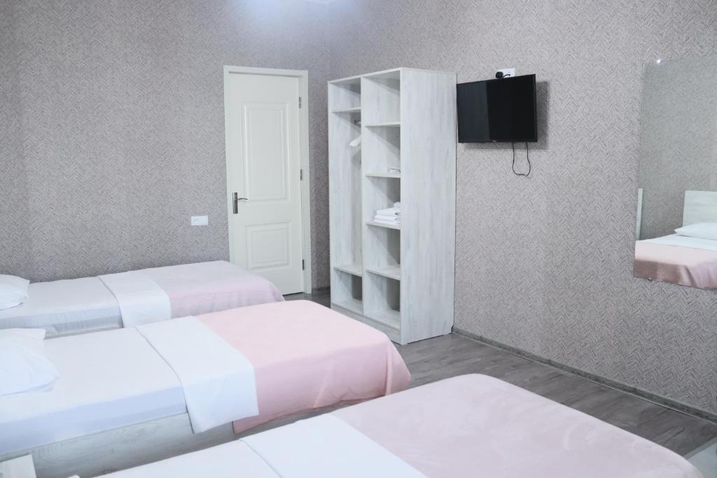 Postel nebo postele na pokoji v ubytování Hotel West Face