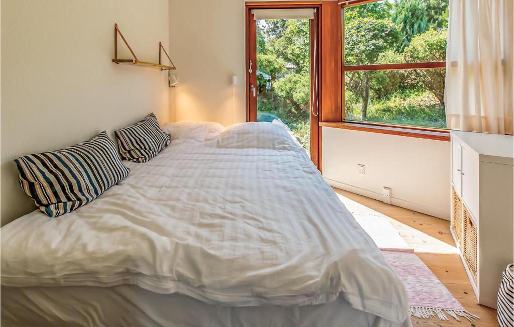 Postel nebo postele na pokoji v ubytování Two-Bedroom Holiday Home In Farevejle