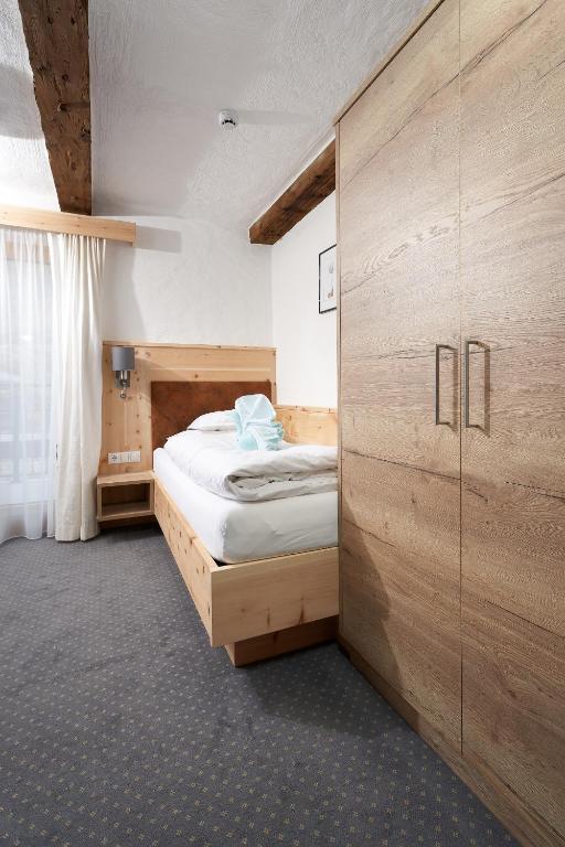 Postel nebo postele na pokoji v ubytování Hotel am Hof