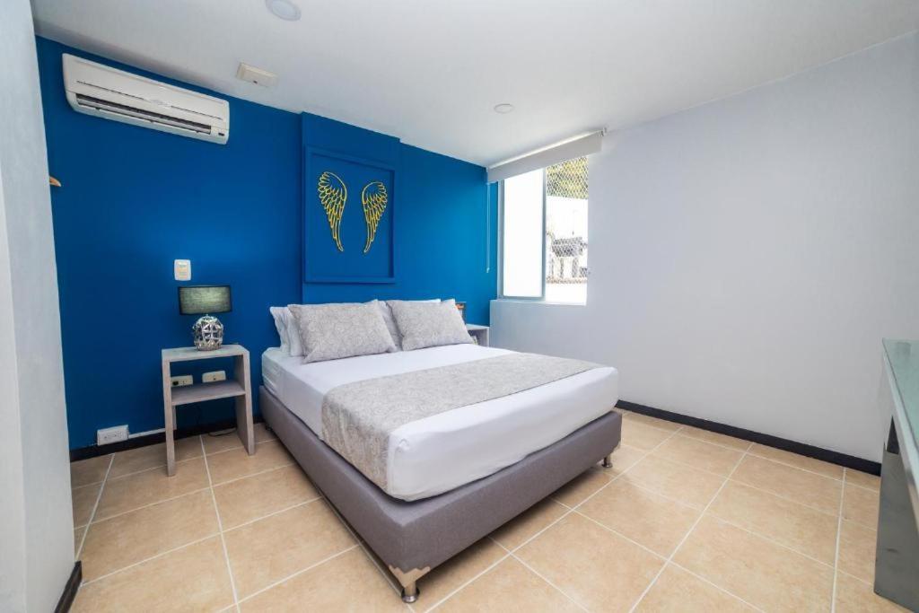 Postel nebo postele na pokoji v ubytování Greenview Medellin By St Hoteles