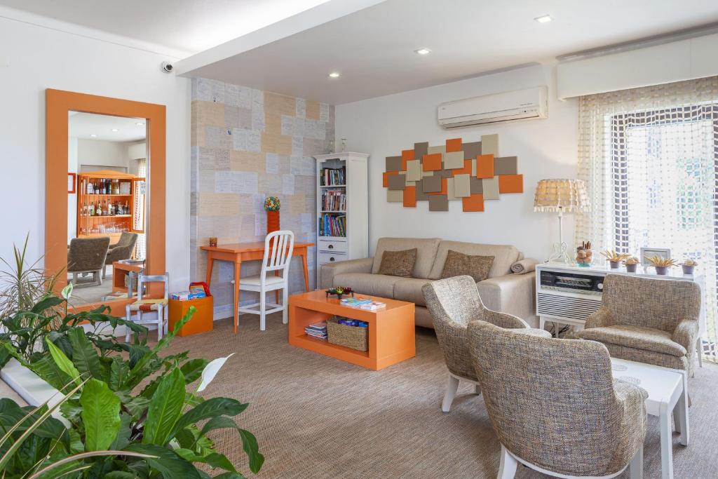a living room with a couch and a table at Boutique Hotel Casa do Outeiro - Arts & Crafts in Batalha