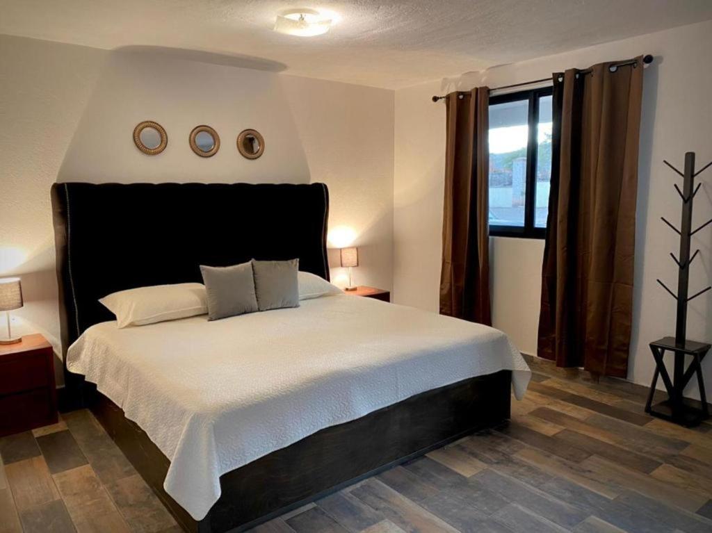 Postel nebo postele na pokoji v ubytování Cabañas, Suites y Habitaciones Rancho San Jorge