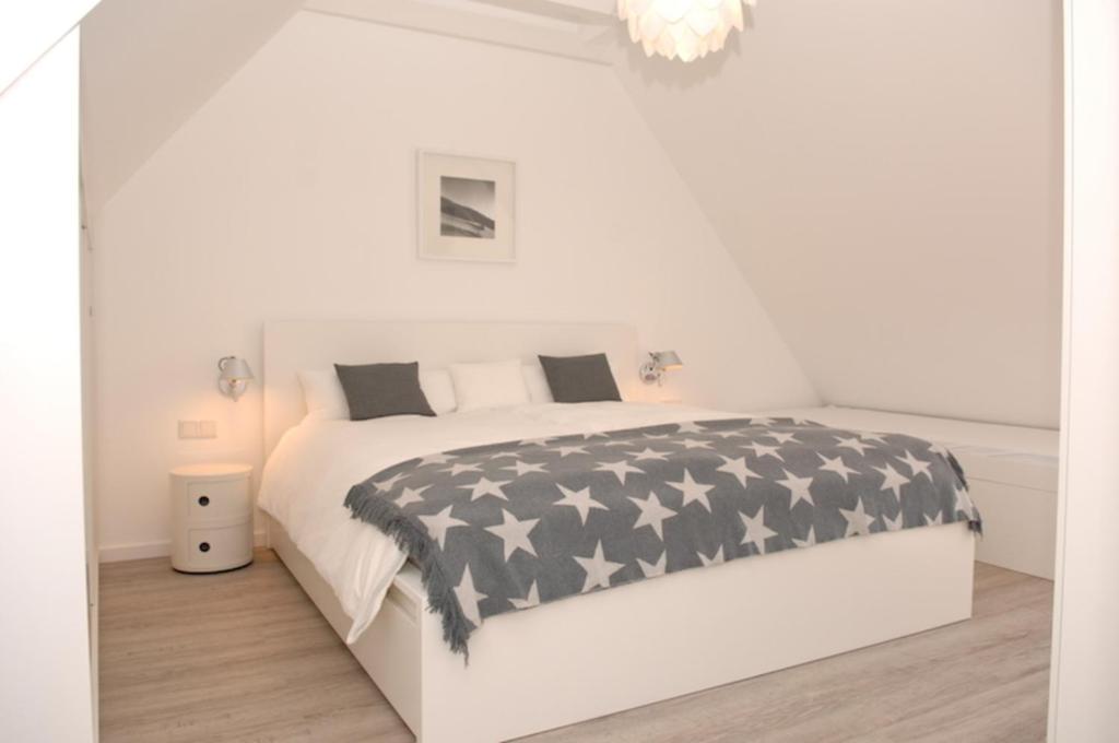 Postel nebo postele na pokoji v ubytování Haus Flora - Golden Knoepke